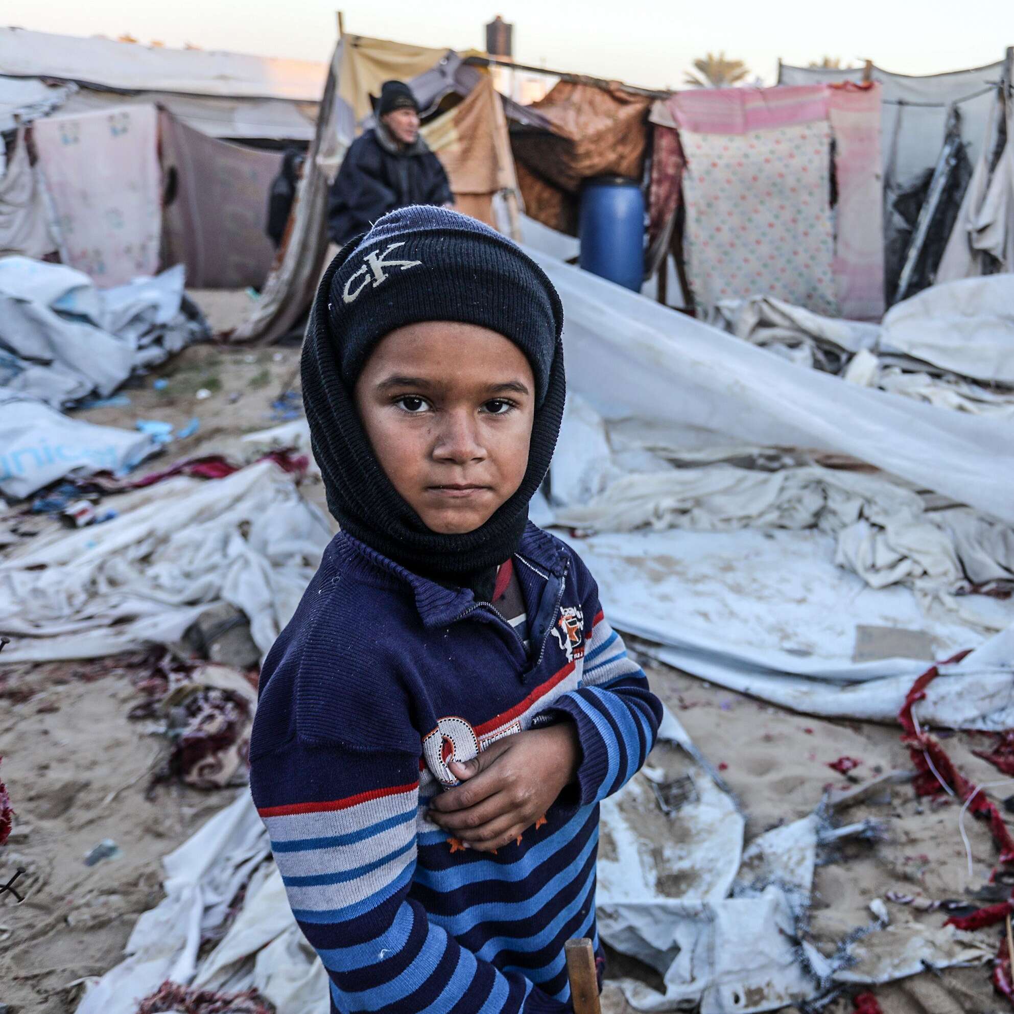 A child in front of tents in the Gaza Strip. 
